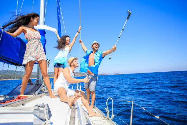 istock Young people taking selfie on yacht 942527532