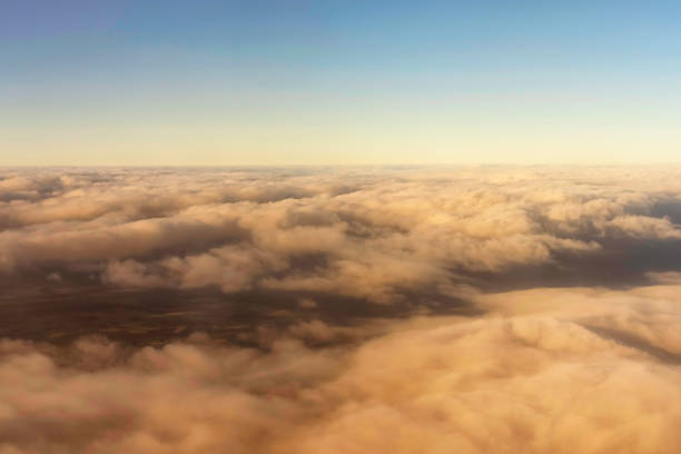 istock CCumulus clouds highlighted in the morning sun view from the air 942533252