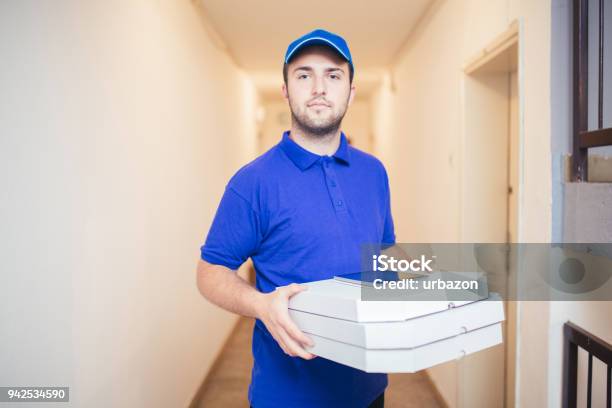 Delivery Boy Bringing Pizza Stock Photo - Download Image Now - Adult, Blue, Business