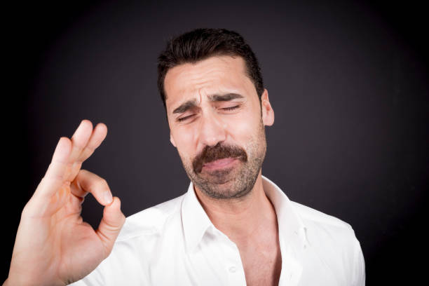 Young handsome man with beard and mustache studio portrait