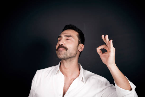 Young handsome man with beard and mustache studio portrait