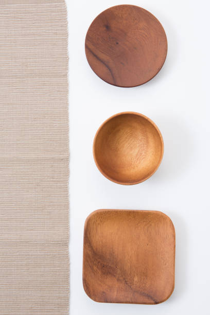 istock Wooden plates on white background 942540504