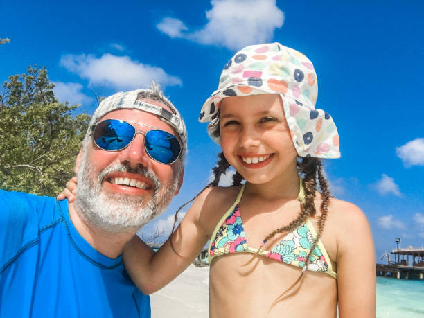 istock Father and Daughter on a Beach Together 942540684