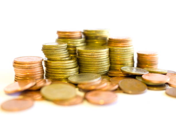 istock Stack of golden and copper coins on white background 942541278