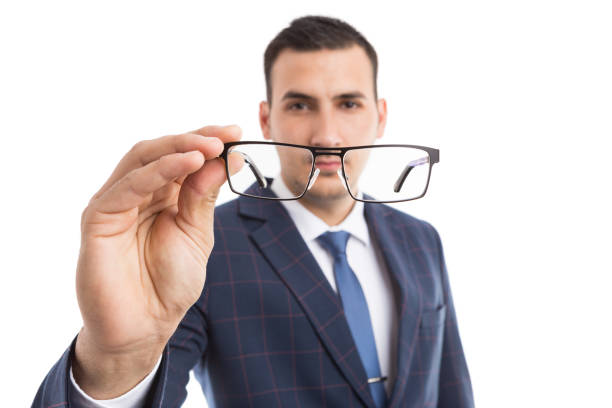 istock Optics concept with young businessman focus on glasses 942546416