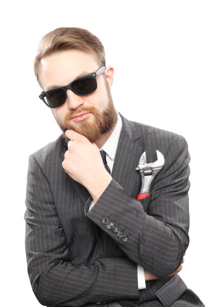 istock Bearded man in suit and wrench insite pocket 942546912
