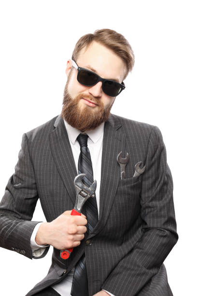 istock Bearded man in suit and wrench insite pocket 942547008