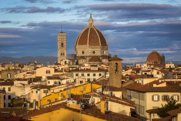 Sunrise over city of Florence. Warm light iluminates roofs and cathedral cupola. Next bell tower Sunrise over city of Florence. Warm light iluminates roofs and cathedral cupola. Next bell tower. michelangelo italy art david stock pictures, royalty-free photos & images