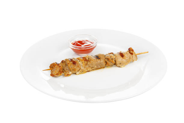 istock Shish kebab with sauce isolated without garnish 942547540