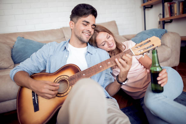 istock Young couple relaxing in their apartment 942552068