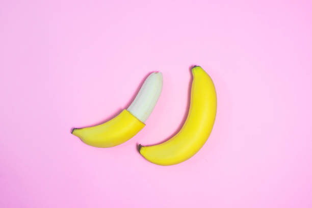 istock Single banana on color background., From top view. 942556122