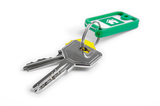 istock Key ring with keys over white background. Home 942556140
