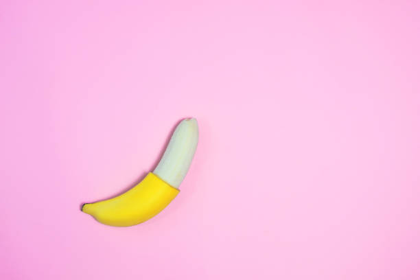 istock Single banana on color background., From top view. 942556196