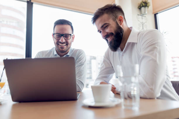 istock Two confident businessman sitting in modern office 942564220