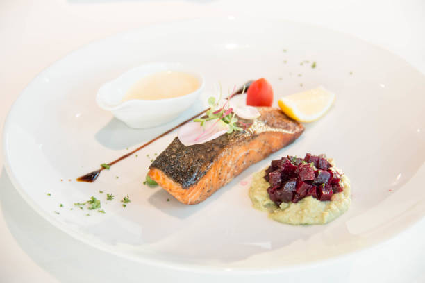 istock Tasty grilled salmon steak on mixed colorful vegetables 942564542