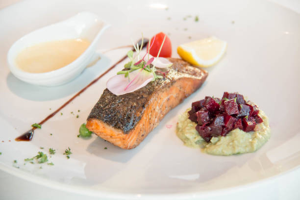 istock Tasty grilled salmon steak on mixed colorful vegetables 942567604