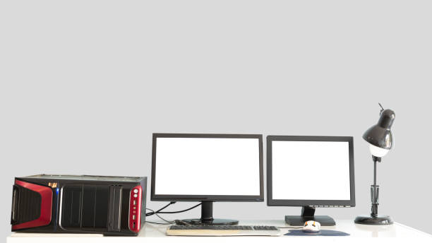 Old Desktop PC with 2 monitors on desk isolated.