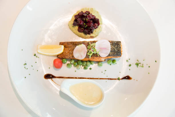 istock Tasty grilled salmon steak on mixed colorful vegetables 942571484