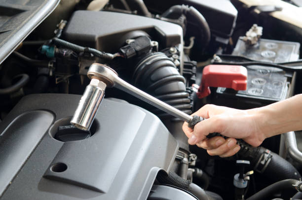istock Mechanic hand and block tool for fix car at garage 942571552