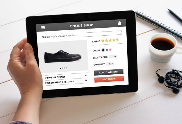 istock Hand holding tablet with online shop concept on screen 942575618