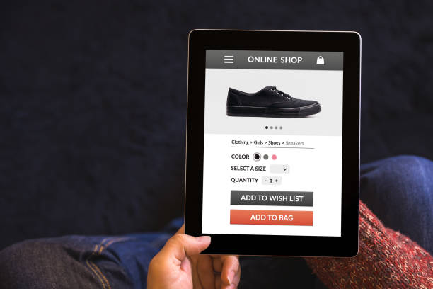 istock Hands holding tablet with online shop concept on screen 942575620