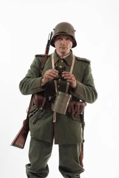 Actor in the form of a German infantryman from the times of the First World War
Posing on white background