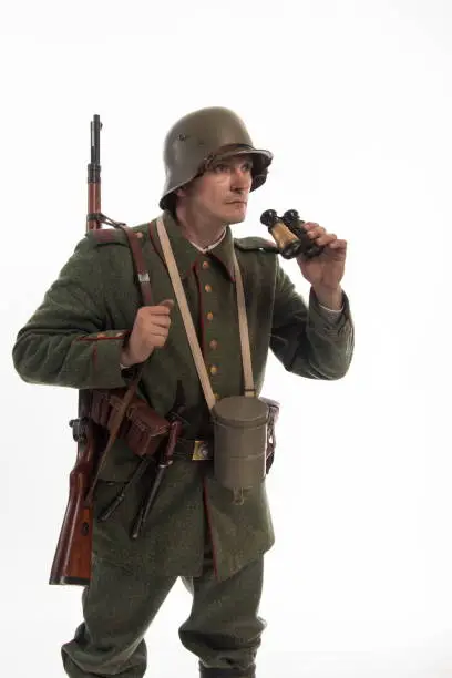 Actor in the form of a German infantryman from the times of the First World War
Posing on white background