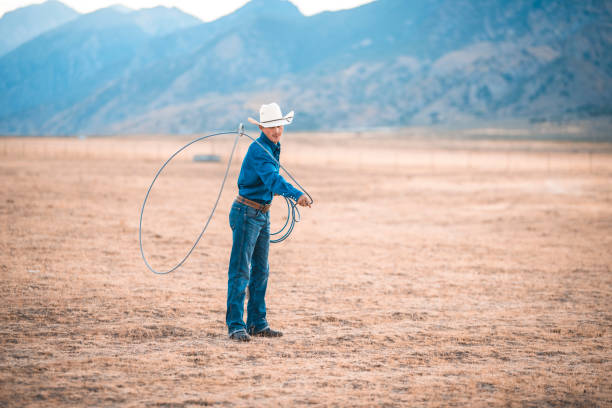 istock Cowboy lassoing in nature 942580258