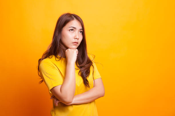 istock Serious  young Asian woman  look away. 942584222