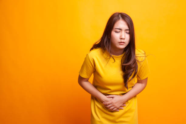 istock Young Asian woman got stomachache. 942585084