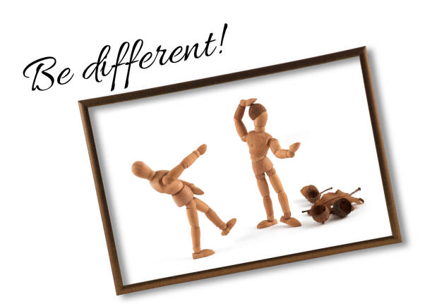 istock wooden mannequin motivational ideas with text - Be different 942587802