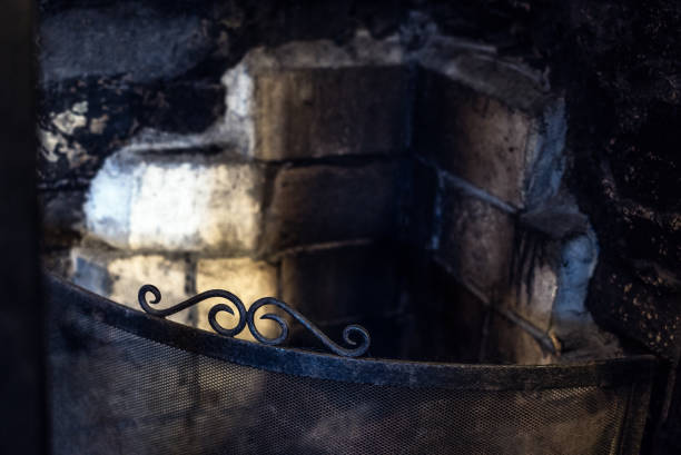 Soot, stains and burnt bricks gives this traditional fireplace a creepy, gothic look.