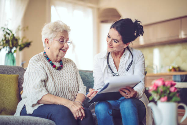 istock Social worker is visiting a senior woman 942591826