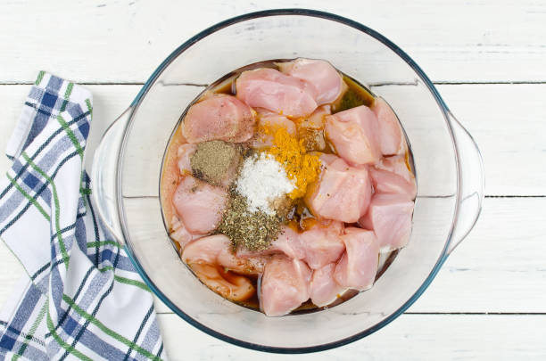 Raw pieces of chicken marinated in spices Raw pieces of chicken marinated in spices. Step-by-step cooking marinade stock pictures, royalty-free photos & images