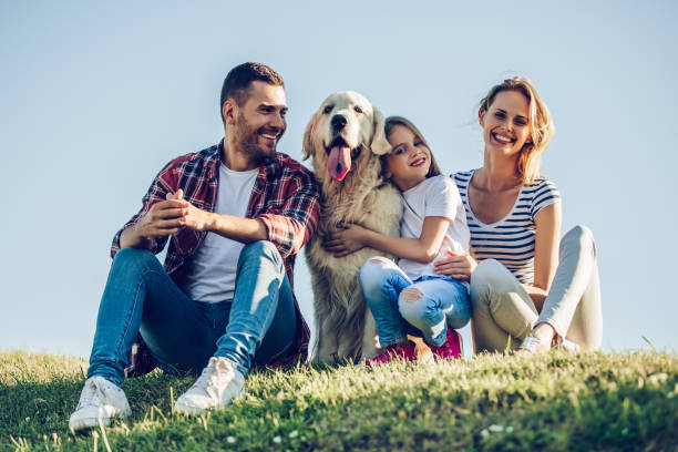 istock Happy family with dog 942596452