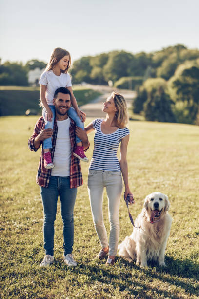 istock Happy family with dog 942596524