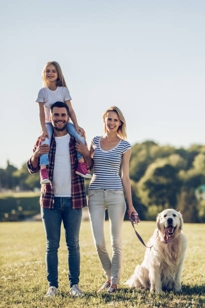 istock Happy family with dog 942596530