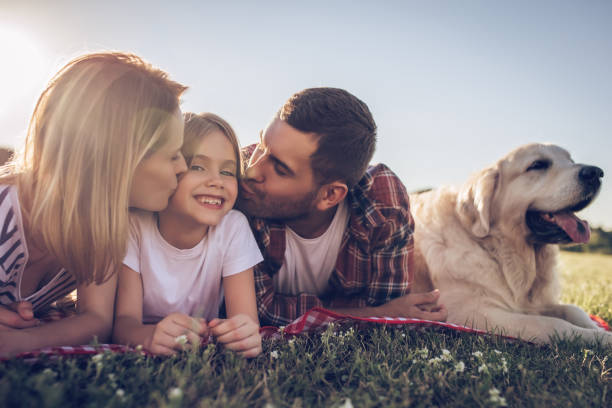 istock Happy family with dog 942596656