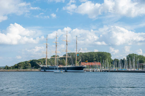 View over the river Trave toward the four-masted sailing ship Passat in Travemuende at the Baltic Sea, Schleswig-Holstein, Germany, Europe