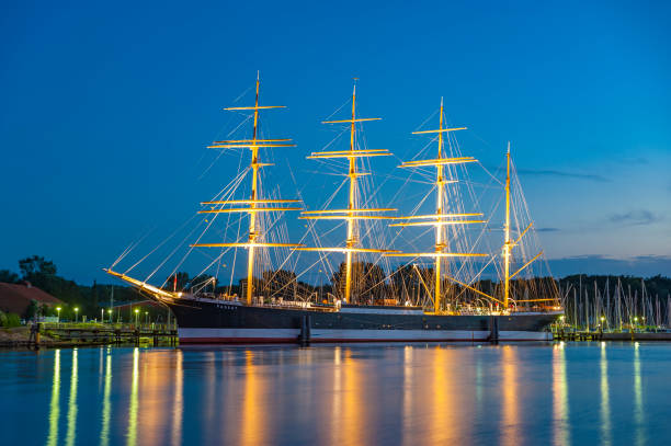 View over the river Trave toward the four-masted sailing ship Passat in Travemuende at the Baltic Sea, Schleswig-Holstein, Germany, Europe