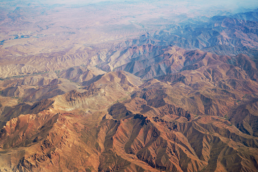 Aerial view at mountain range in the desert from airplane above Pakistan. Geological surface structures of planet earth. No people. XXXL (Sony Alpha 7R)