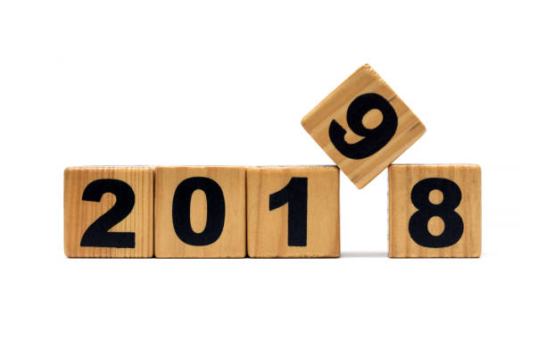 istock New Year 2019 and Old 2018 with wood block isolated 942603918