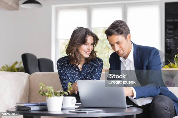 Modern Business People Working At A Cafe Stock Photo - Download Image Now - Financial Advisor, Business, Couple - Relationship