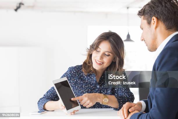 Two Business People Working Together In Office Stock Photo - Download Image Now - Analyzing, Corporate Business, Finance