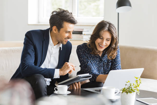istock Modern business people working at a cafe 942608206