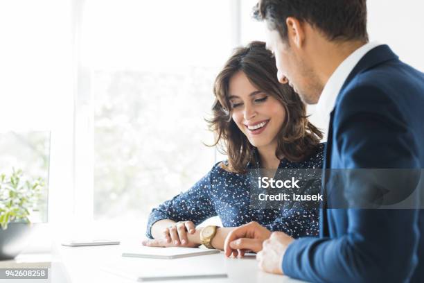 Business Couple Meeting In Office Stock Photo - Download Image Now - Financial Advisor, Business Meeting, 20-29 Years