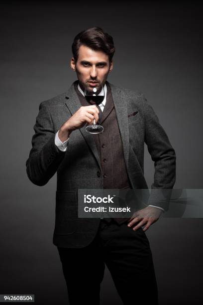 Handsome Young Man With A Glass Of Wine Stock Photo - Download Image Now - Fashionable, Looking At Camera, Men