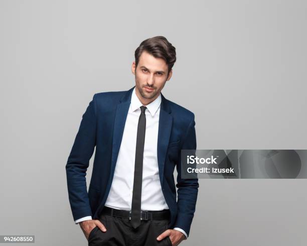 Portrait Of Elegant Young Man In Suit Stock Photo - Download Image Now - Suit, Men, Fashion Model