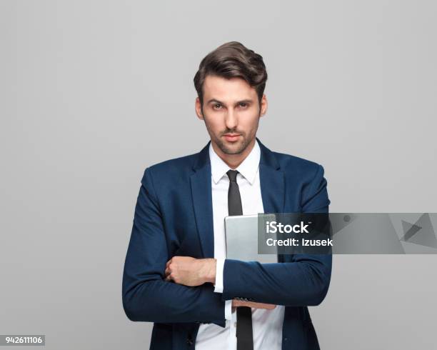 Handsome Businessman Holding Digital Tablet Stock Photo - Download Image Now - Adult, Adults Only, Business