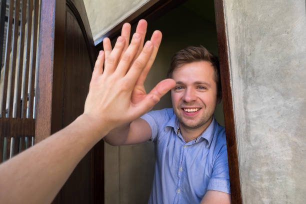 istock Caucasian man giving five to his neighbor. 942611454